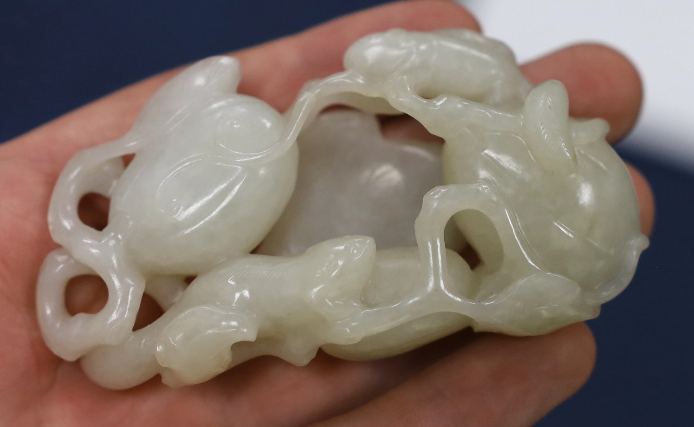 A Chinese white jade carving of a cluster of melons, 18th century